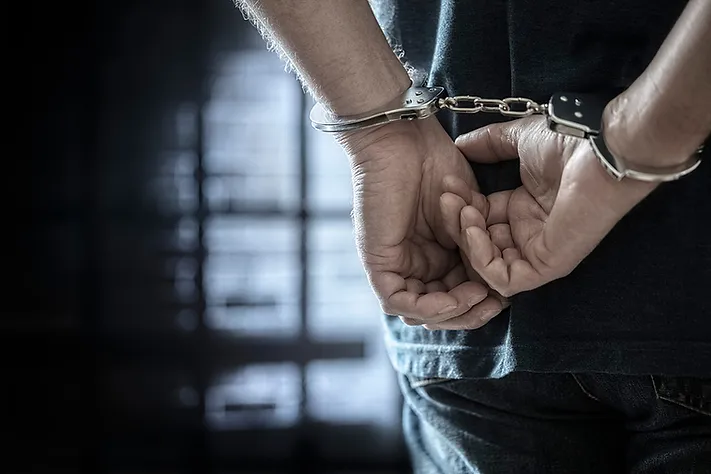 handcuffed man representing Sex Crimes Allegations